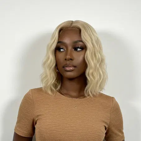 Woman wearing a brown dress against a white background