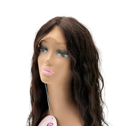 Brown wig on a mannequin head with a visible brand tag against a white background