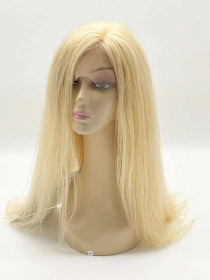 Blonde wig on a mannequin head against a white background