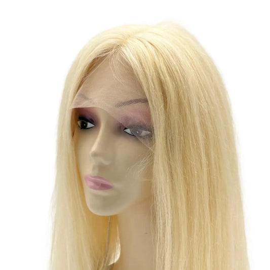 Blonde wig on a mannequin head against a white background