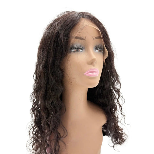 Mannequin head with a brown wavy wig on a white background