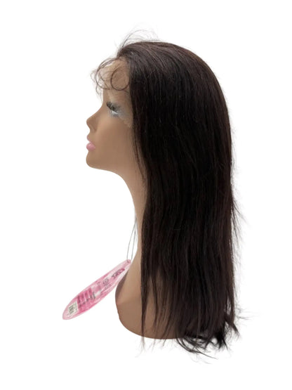 Black wig on a mannequin head with a white background