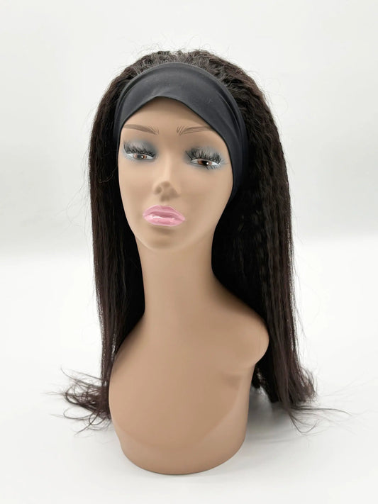 Mannequin head with a dark brown wig on a white background