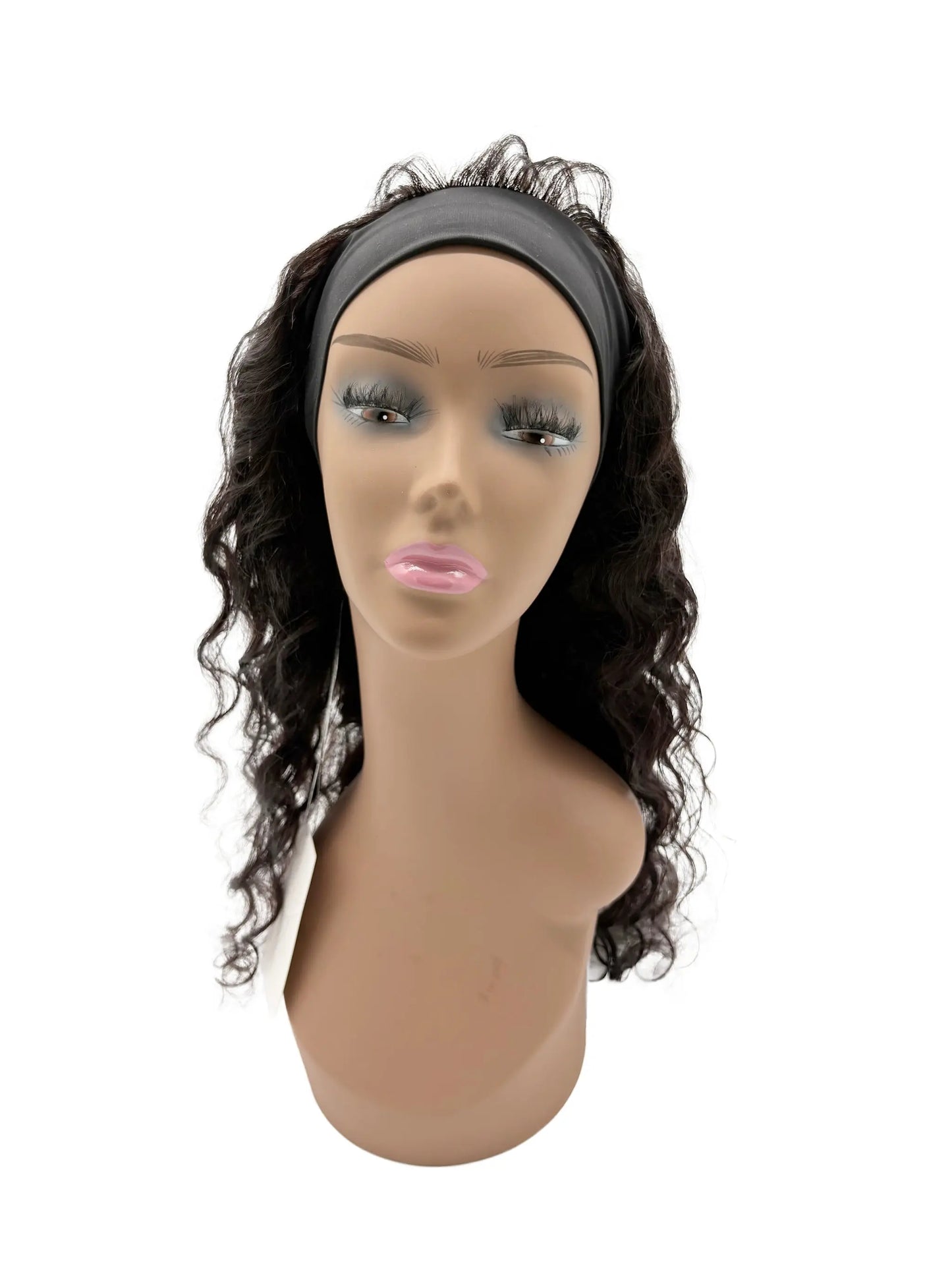 Mannequin head with a black wavy hairpiece on a white background