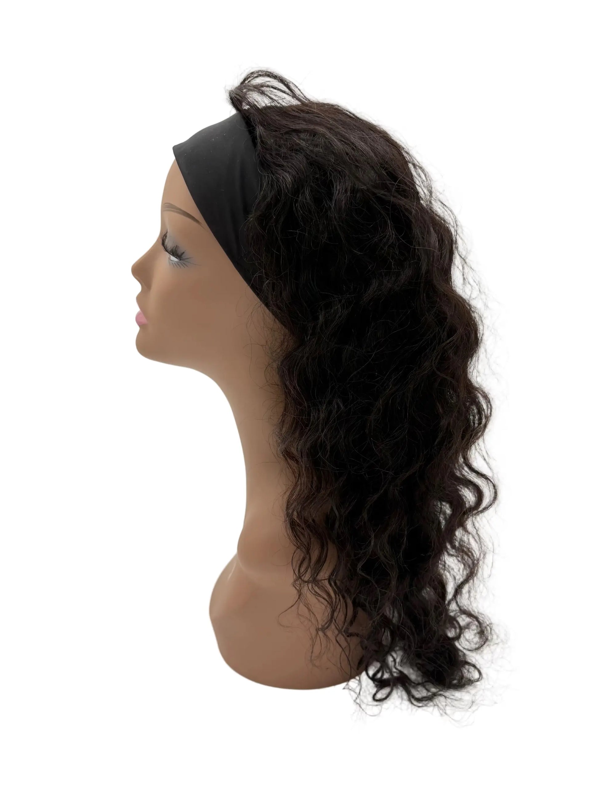 Mannequin head with curly brown hair styled in a ponytail on a white background