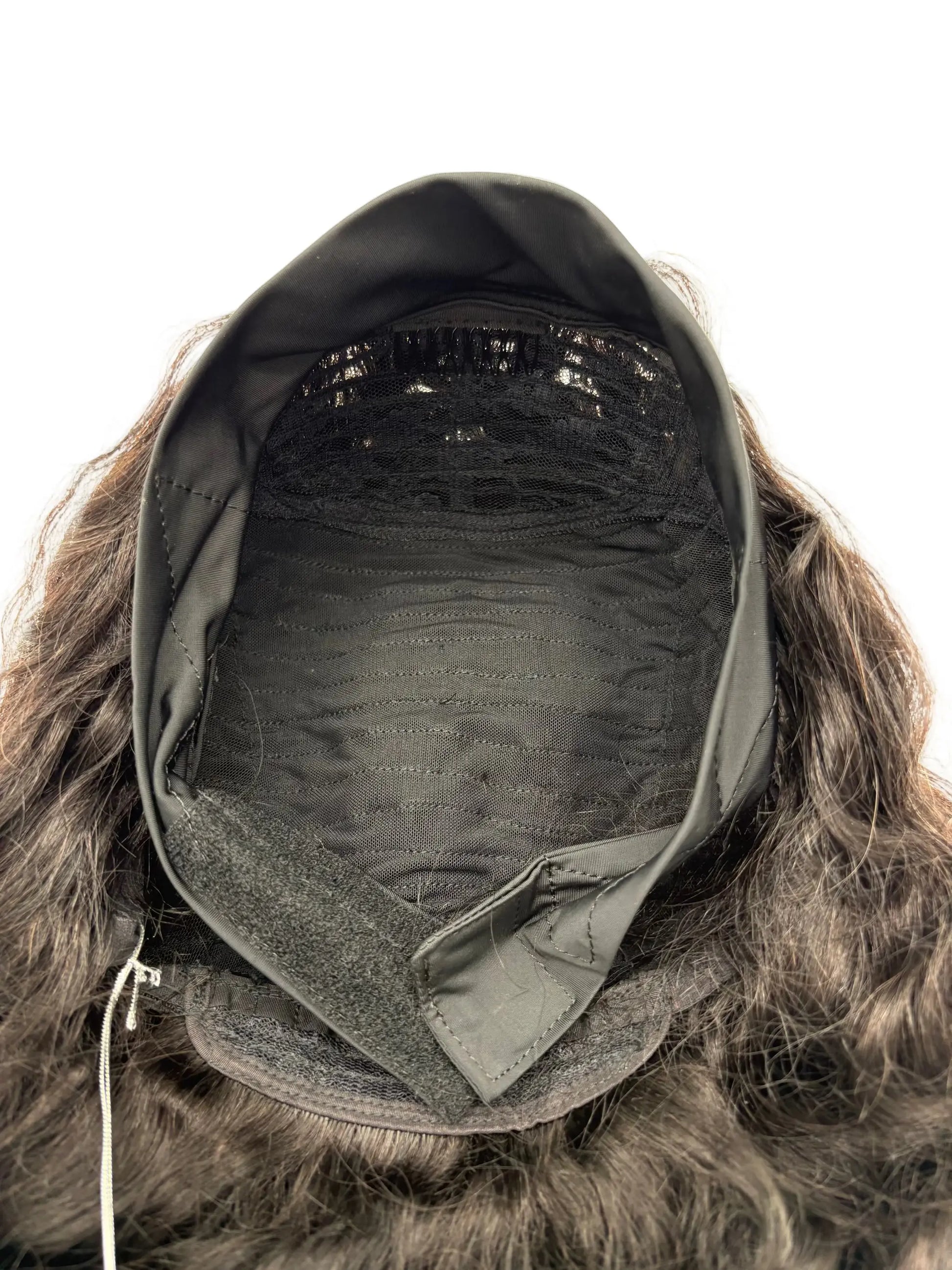 Close-up of a furry hooded garment with a neutral background