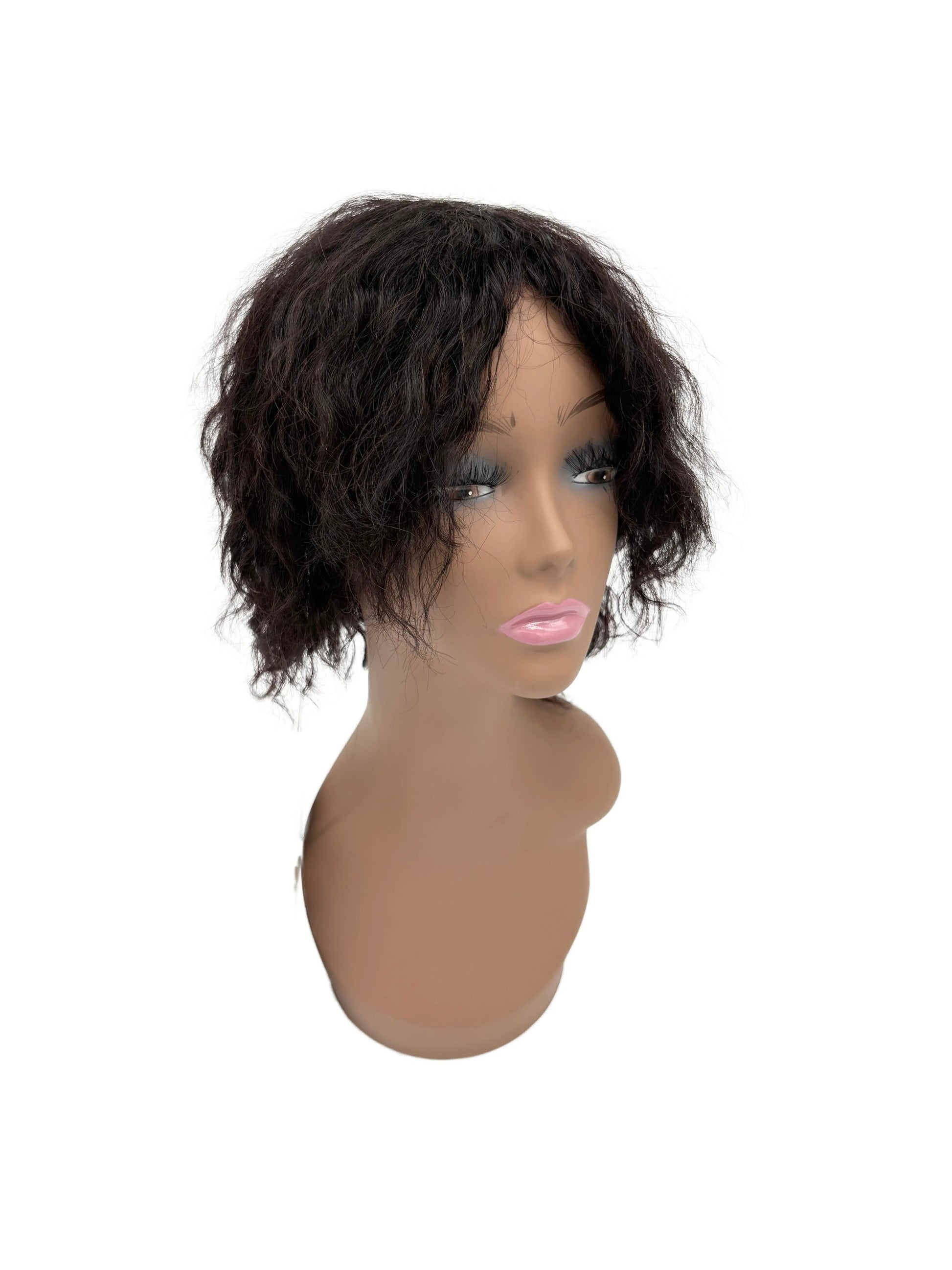 Black wig on a mannequin head against a white background
