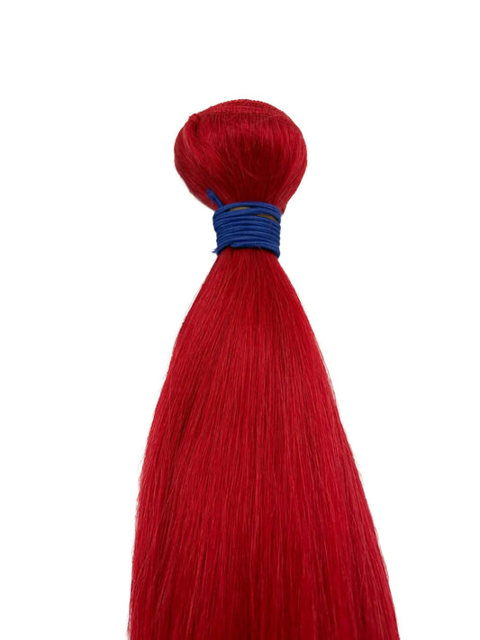 Close-up of KIWI red straight human hair bundle