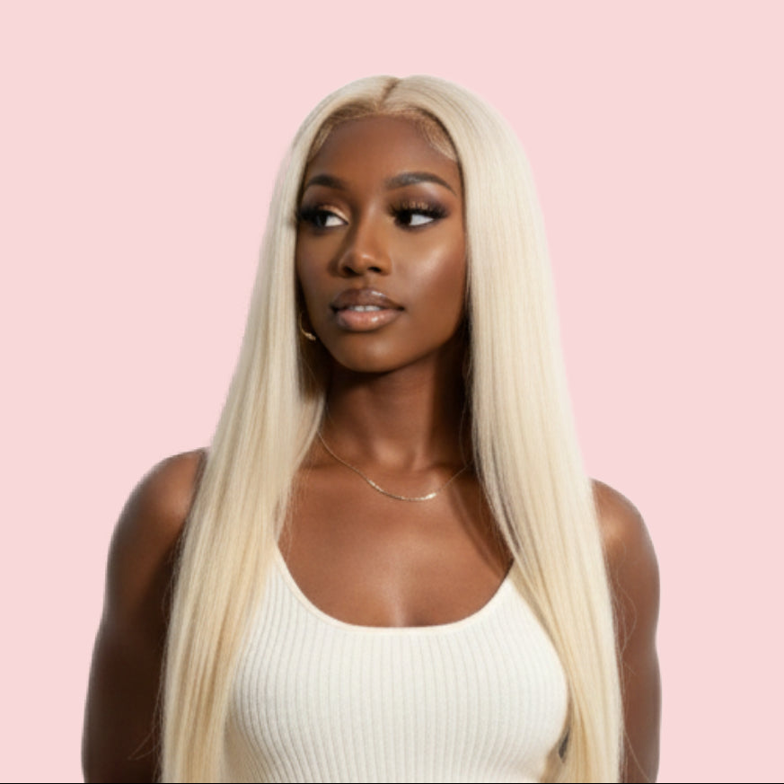 Woman with long blonde wig on a pink background